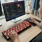 digitaley.co Sunset Glow retro wireless keyboard and mouse set with round, typewriter-style keycaps in orange, cream, and red.