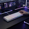 Digitaley.co white compact 60% mechanical keyboard with vibrant RGB backlighting on a desk.
