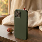 digitaley.co dark green silicone iPhone case with a miniature tea glass motif and steam detail.