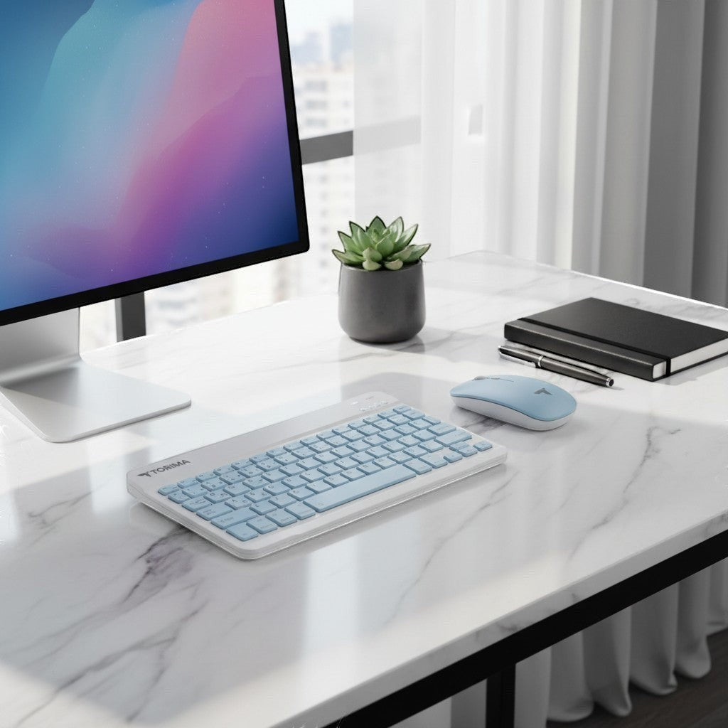 digitaley.co pastel blue wireless keyboard and mouse set with quiet keys on a marble desk.