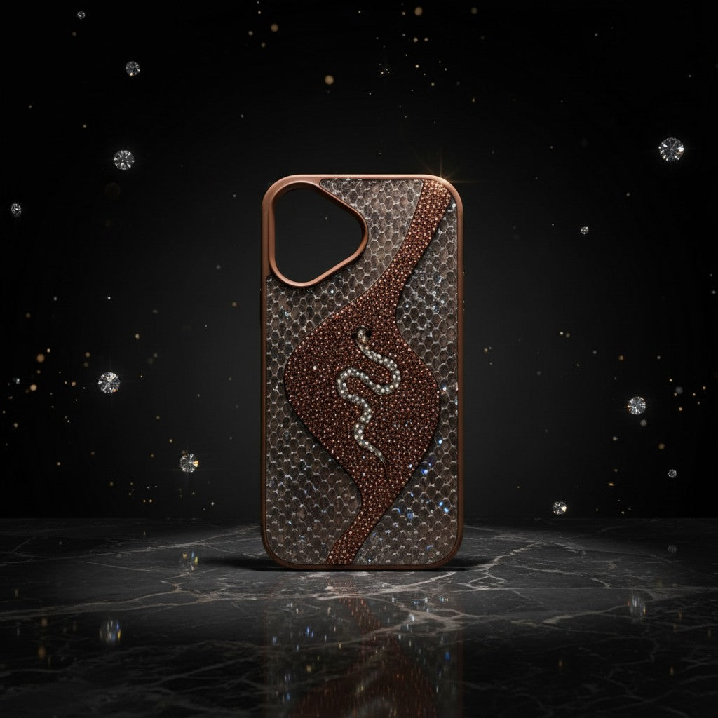 digitaley.co iPhone case with snake motif, embellished with crystals on a textured metallic background.