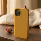 digitaley.co mustard yellow silicone iPhone case with a miniature tea glass motif on top. Features slim-waist design.