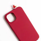 Red iPhone case with a 3D miniature Turkish tea glass and saucer charm. Handmade cultural accessory.